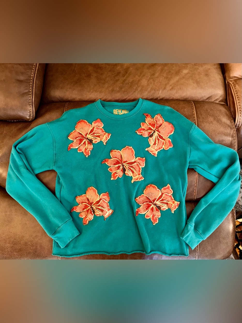 Beyond Shimmer by Anagails Teal/Green poinsettia Appliqué Crewneck Sweatshirt